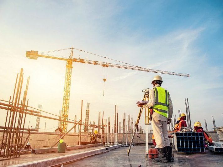 AIG International construction team reviewing plans on site
